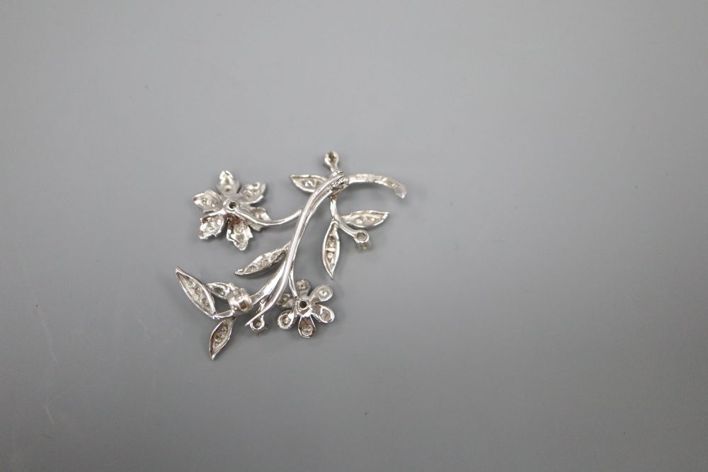 An 18ct white gold and diamond flower spray brooch, in Catchpole & Williams box, 4cm, gross 5.8 grams